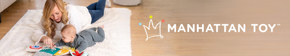 Manhattan Toy sensory activity book with mother and baby playing together on a white nursery rug