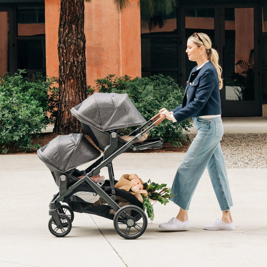 UPPAbaby Vista V3 stroller outdoors with child seating and accessory setup