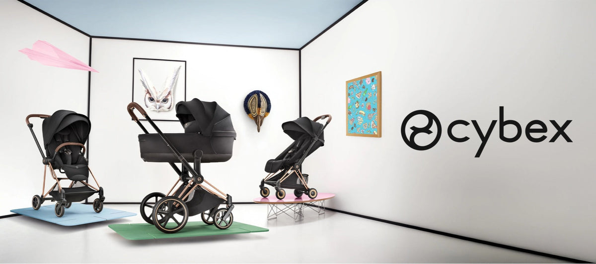 CYBEX Mios, Priam and Coya strollers in black with rose gold frames displayed in a modern gallery