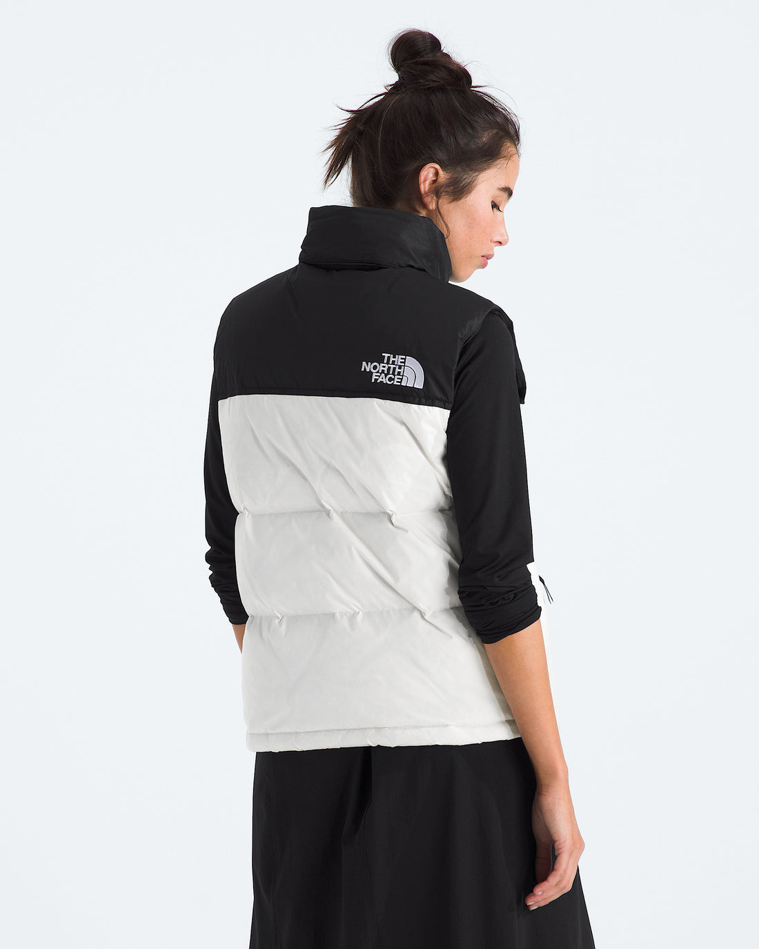 The North Face Women’s 1996 Retro Nuptse Vest in White Dune and TNF Black, back view