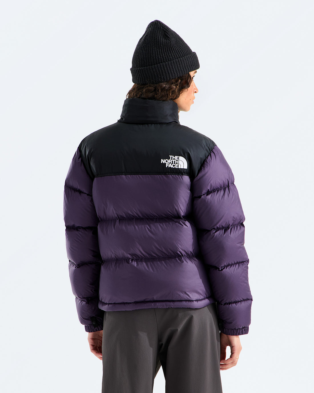 The North Face Women’s 1996 Retro Nuptse Jacket in Endless Dusk/TNF Black, back view