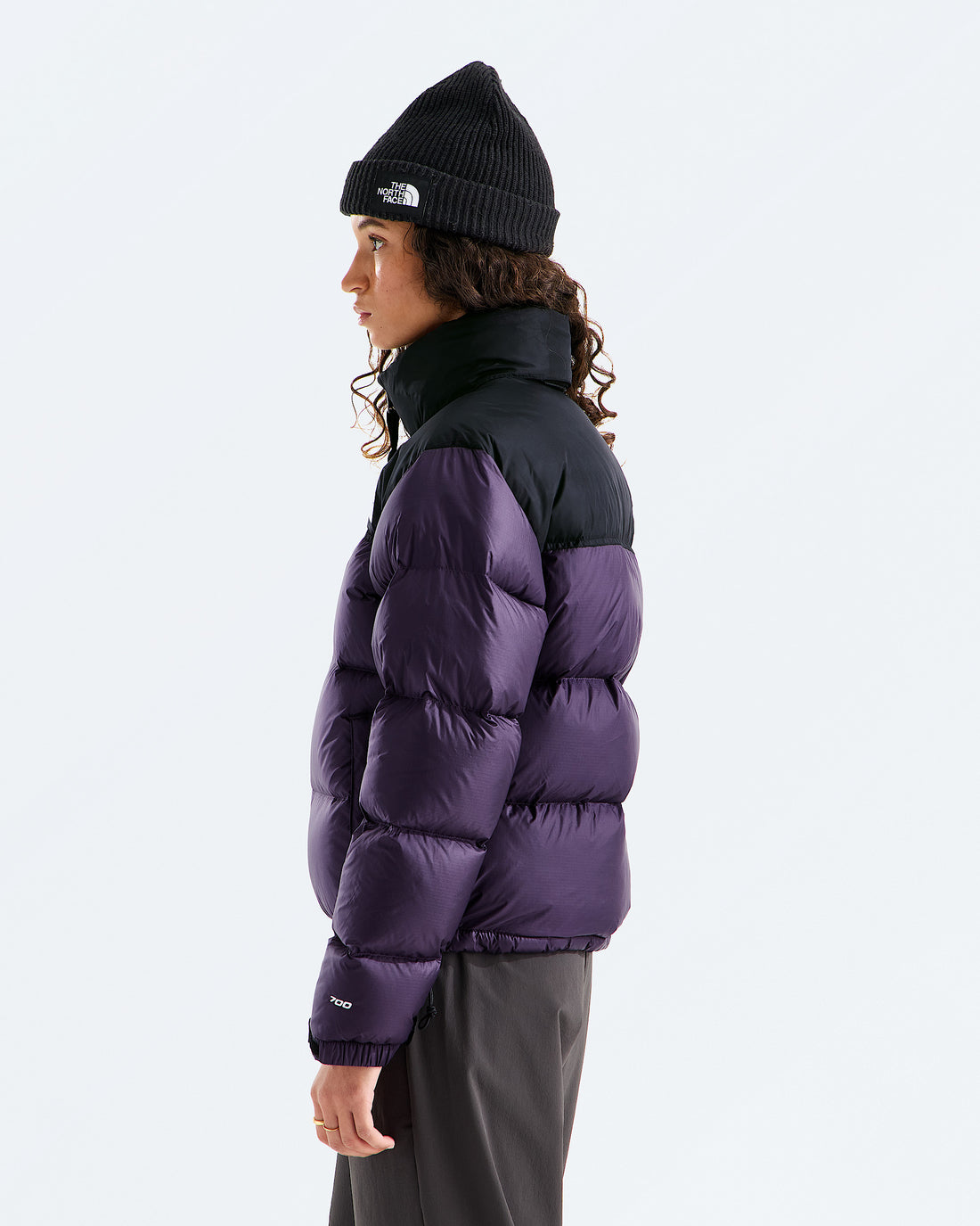 The North Face Women’s 1996 Retro Nuptse Jacket in Endless Dusk/TNF Black, three-quarter model view