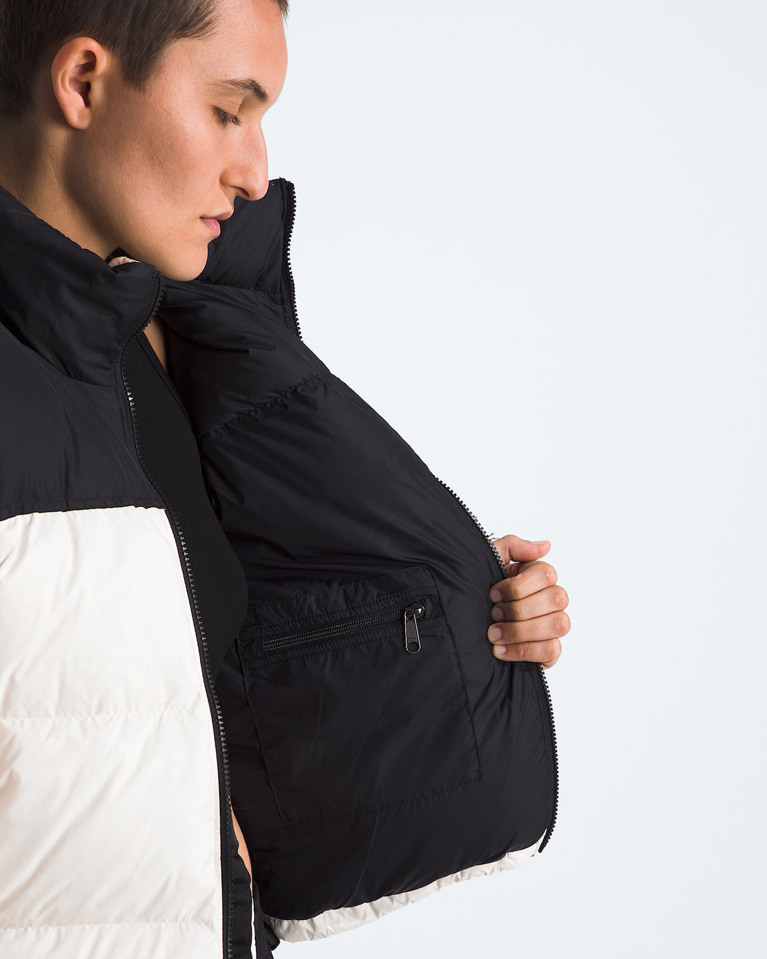 The North Face Women’s 1996 Retro Nuptse Jacket in White Dune/TNF Black/Recycled Down, interior detail