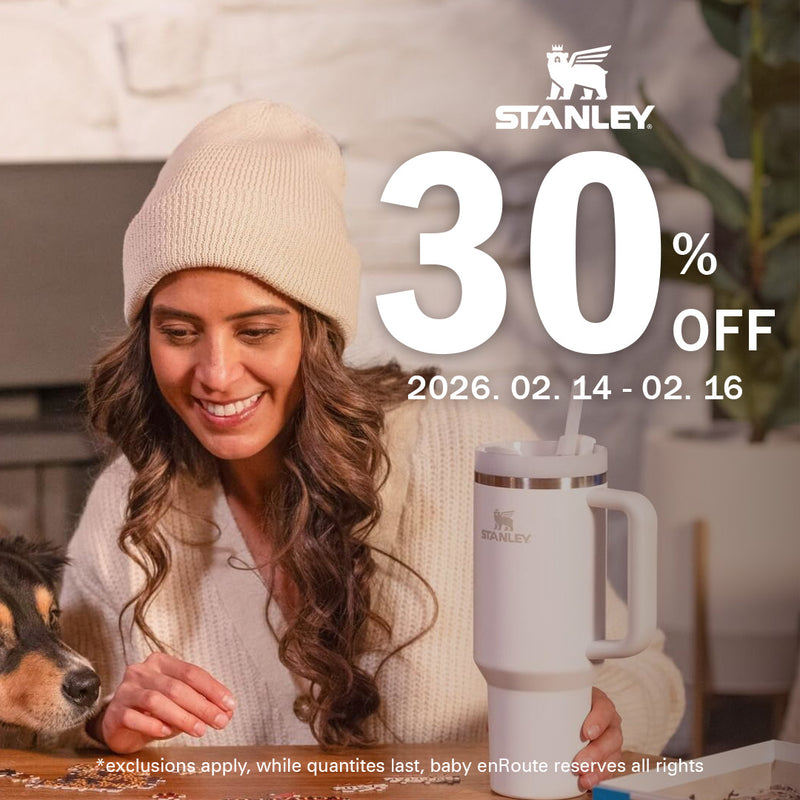 Stanley Adventure Quencher Travel Tumbler in white lifestyle scene with handle 30 percent off sale