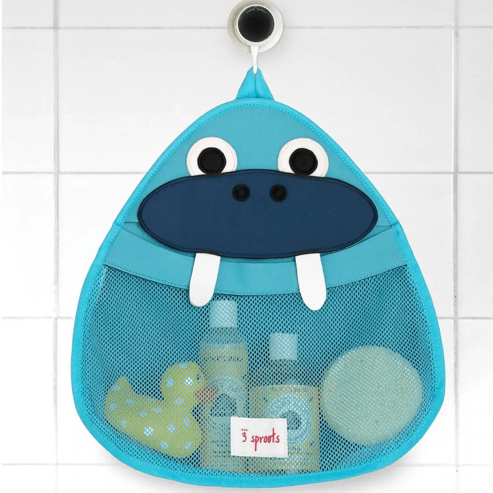 3 Sprouts bath storage hippo bag in bright blue hanging on a hook, mesh front holding bath toys and bottles.
