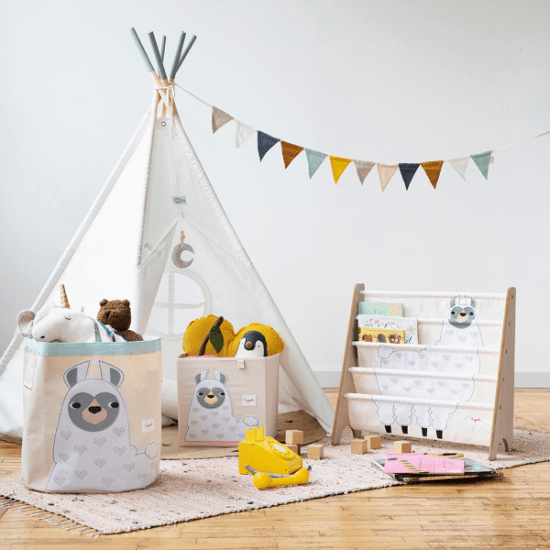 3 Sprouts book rack with neutral animal-print fabric, part of a baby furniture set, shown beside a teepee.