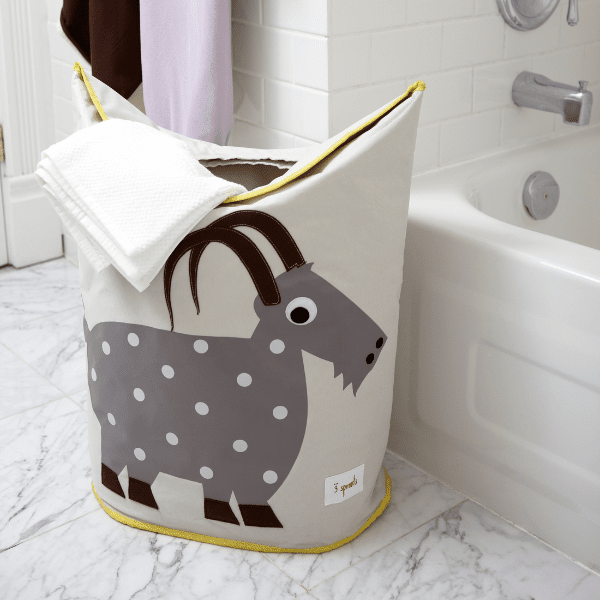 3 Sprouts laundry hamper with gray polka-dot goat design and yellow trim in bathroom