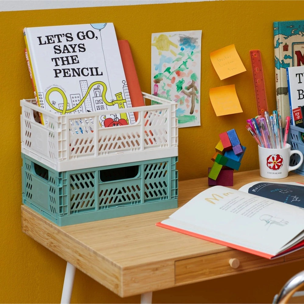 3 Sprouts Modern Folding Crate cream and teal storage crates, 2 crates stacked on a desk