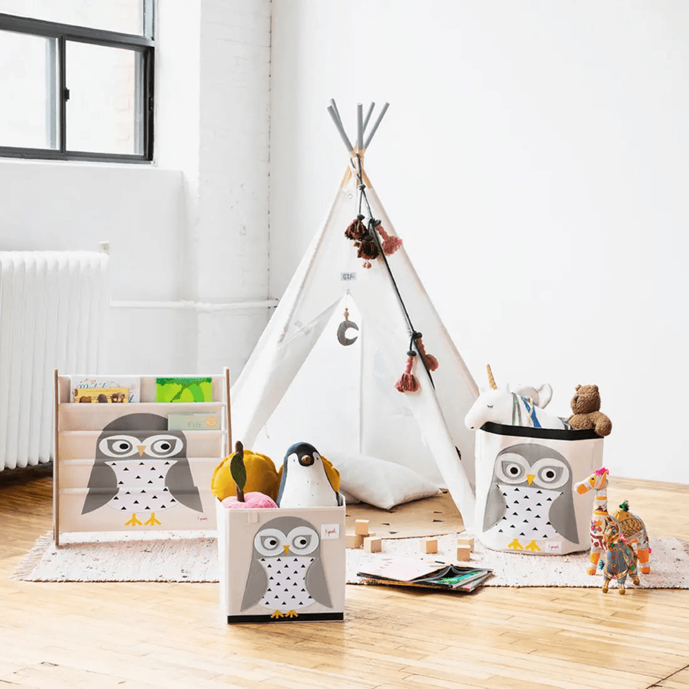 3 Sprouts Storage Bin set with owl print in soft fabric; a 3-pack holding plush toys in a bright kids' playroom.