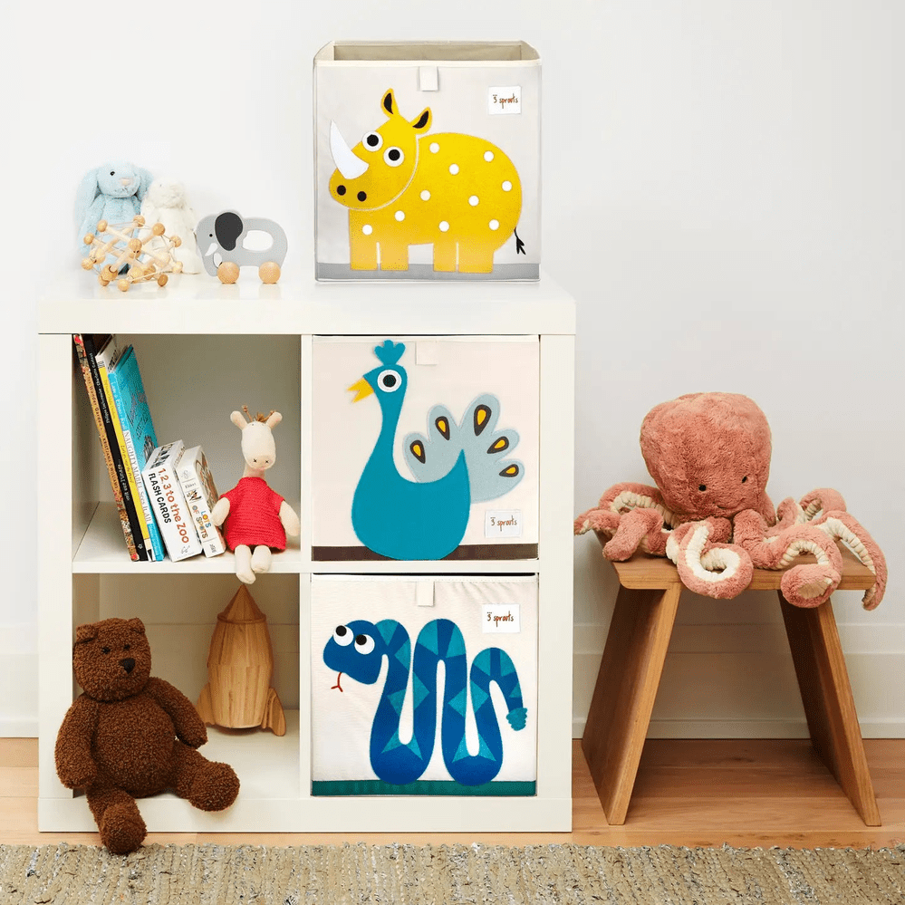 3 Sprouts storage box set with animal prints sits neatly in a white cubby shelf, keeping nursery tidy