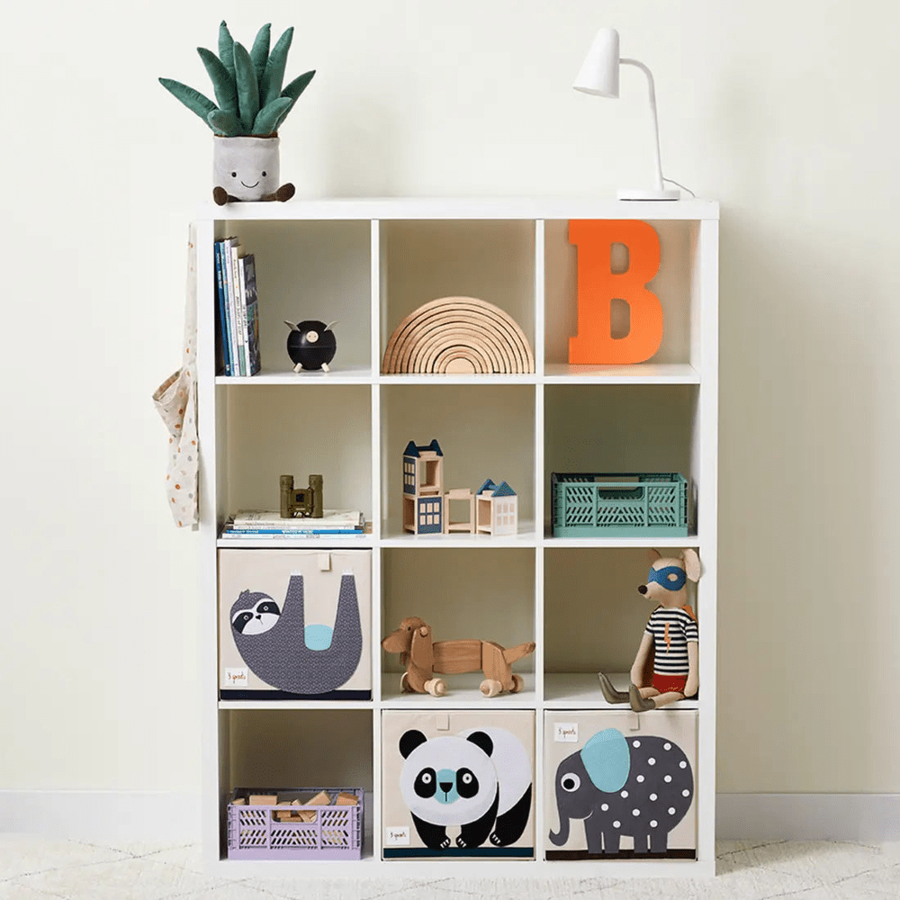 3 Sprouts Storage Box set neatly fills a white cubby shelf with playful animal-print boxes