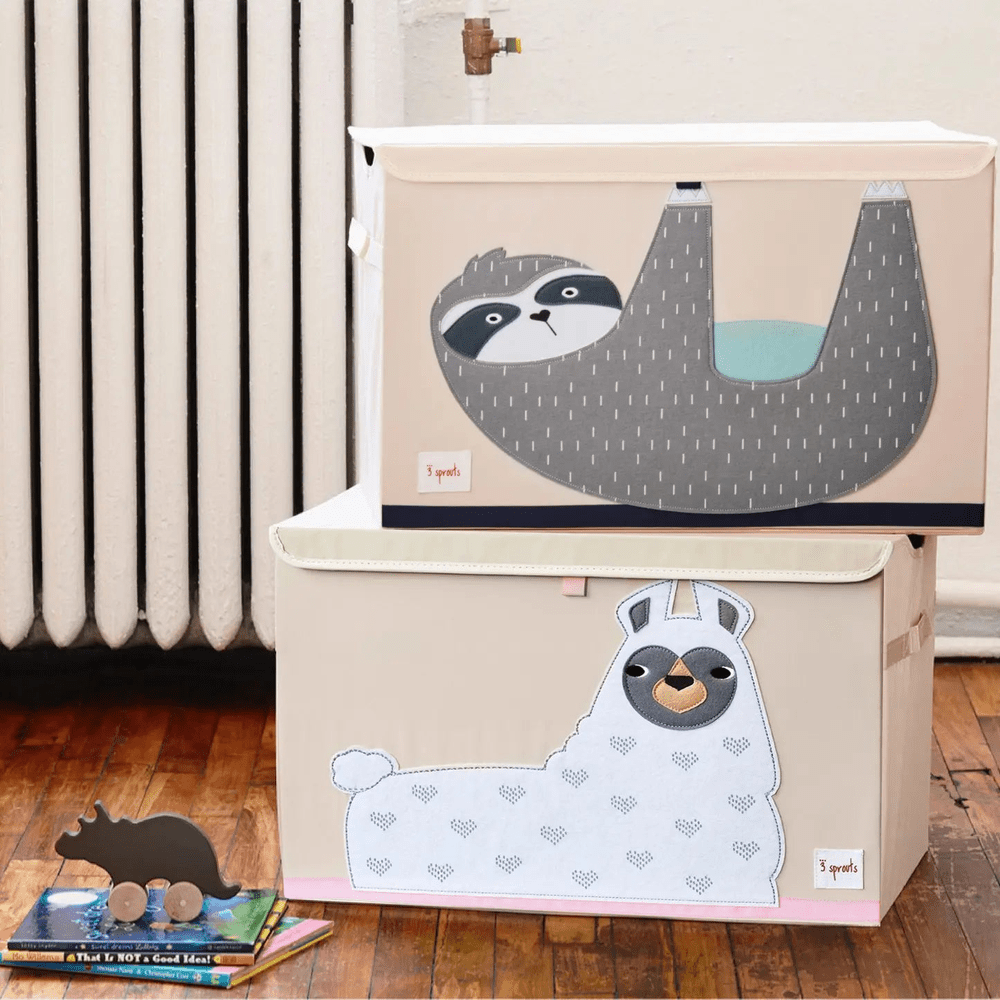 3 Sprouts Toy Chest set with beige bins, sloth lid and llama front panel, neatly stacked in a cozy playroom.