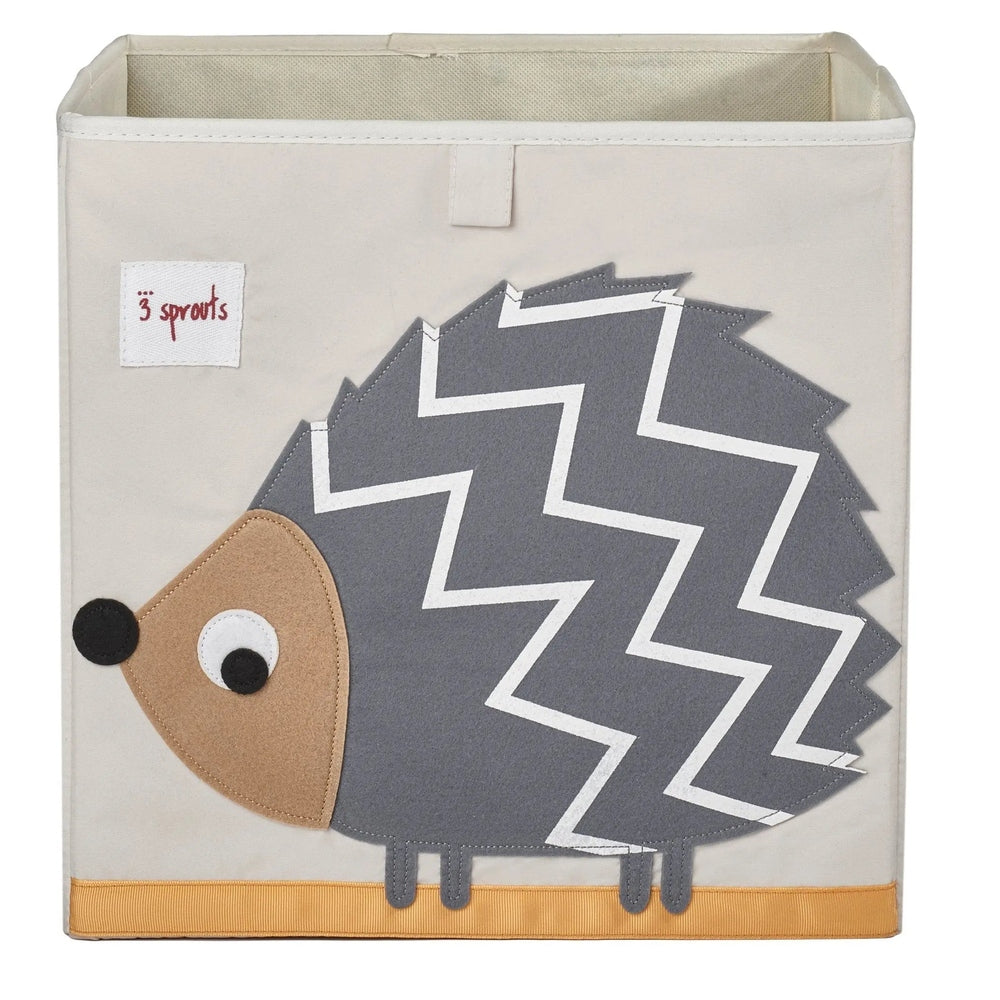 3 Sprouts Storage Box in beige fabric, gray zigzag hedgehog applique and orange base, neatly organizing nursery clutter.