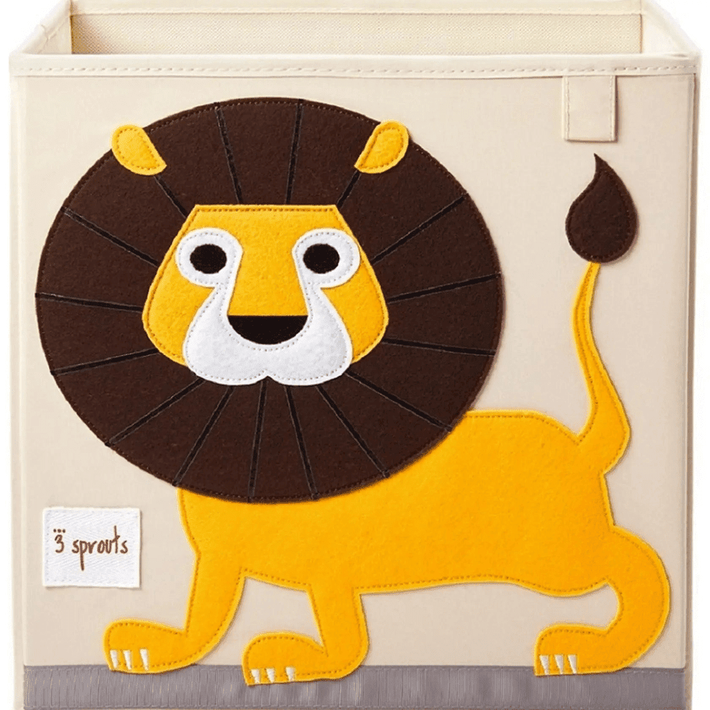 3 Sprouts Storage Box in beige with yellow lion applique, open-top interior for tidy nursery storage.