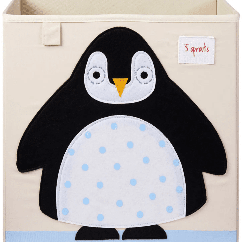3 Sprouts Storage Box featuring a standing penguin applique on a beige box with a black body and light blue polka-dot belly