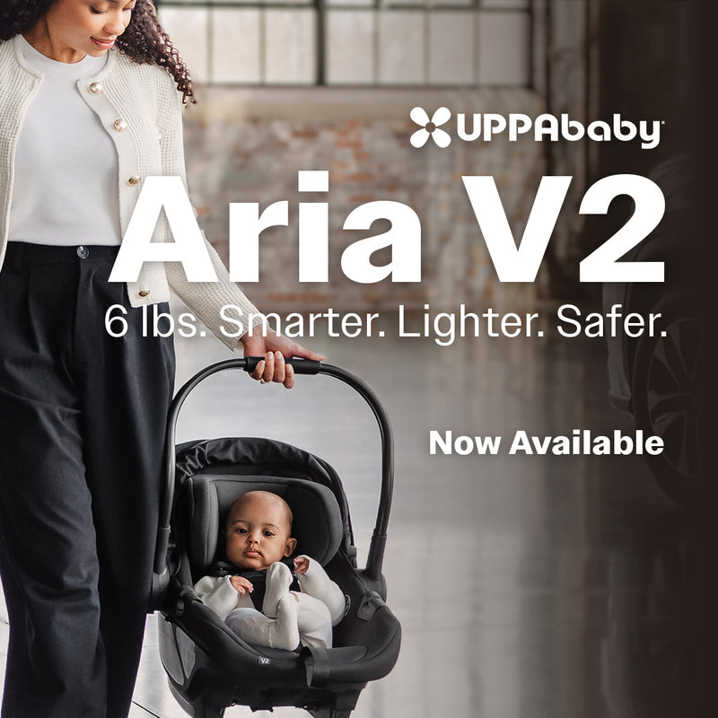 UPPAbaby Aria V2 Infant Car Seat in Black lightweight carry with baby vertical view