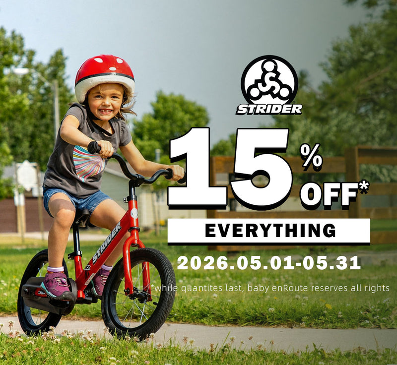 Strider Balance Bike in Red with toddler riding outdoor neighborhood lifestyle view