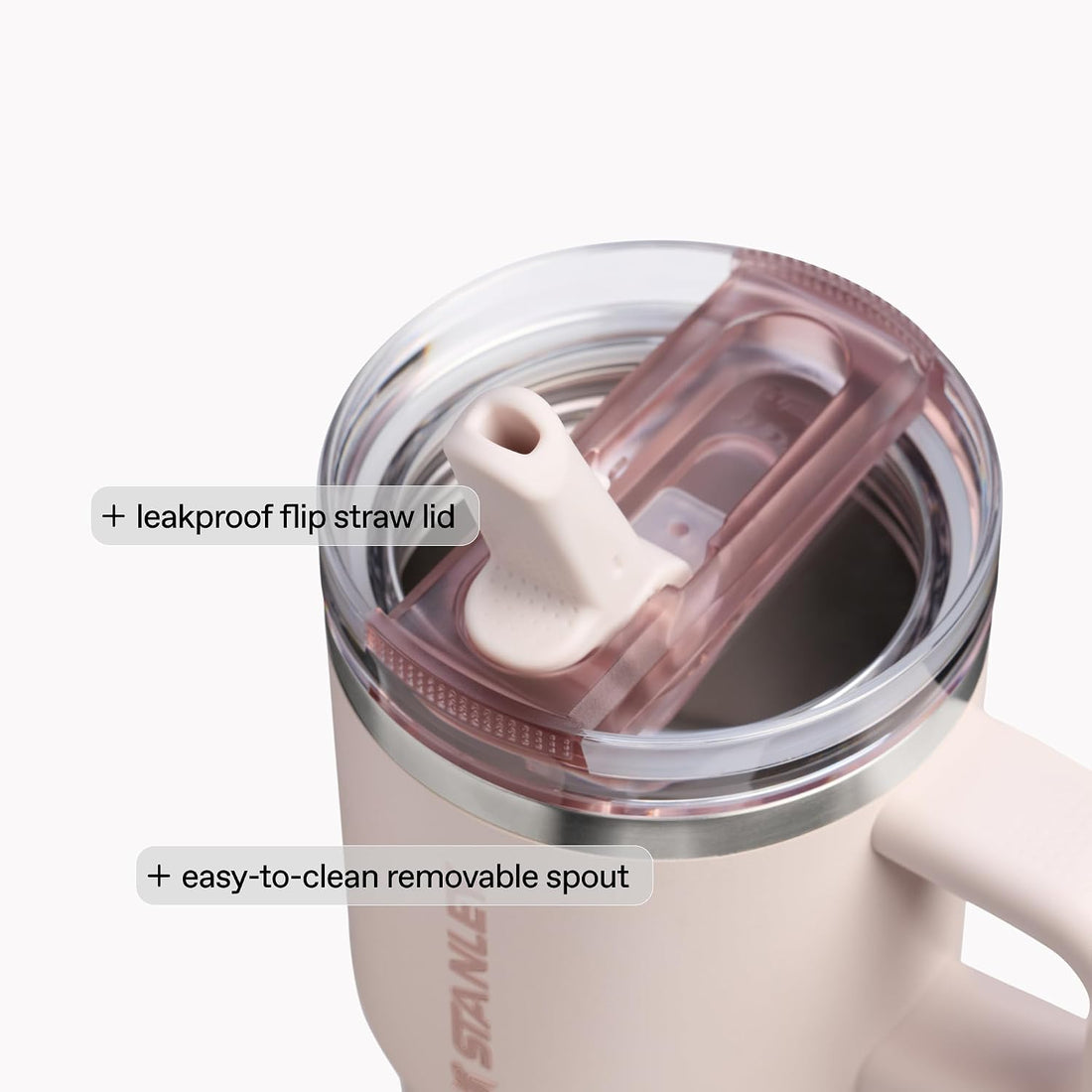 Close-up of a pink tumbler with a leakproof flip straw lid and easy-to-clean removable spout on a white background.