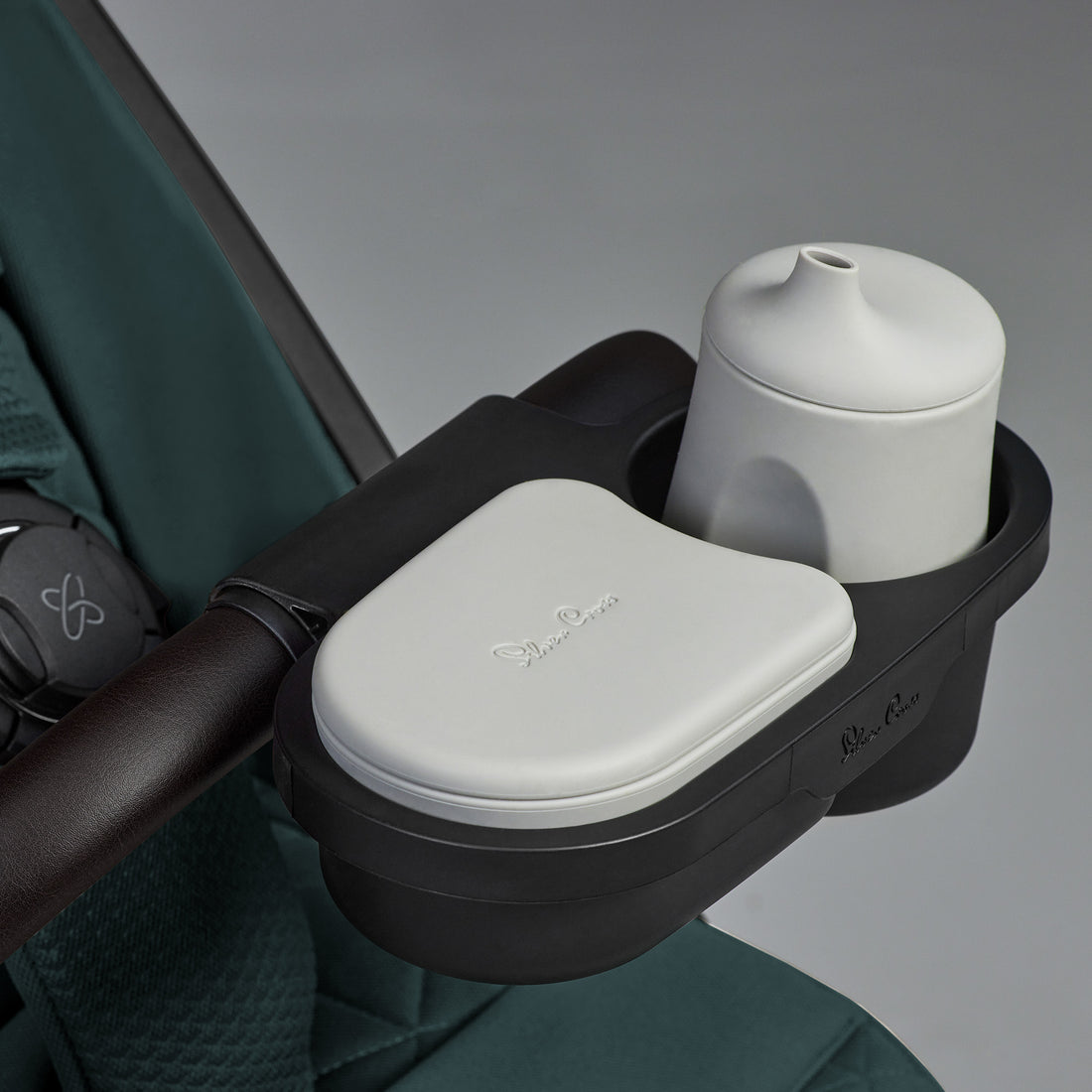 Silver Cross Clic stroller in Conifer with optional Snack Tray shown; accessory sold separately