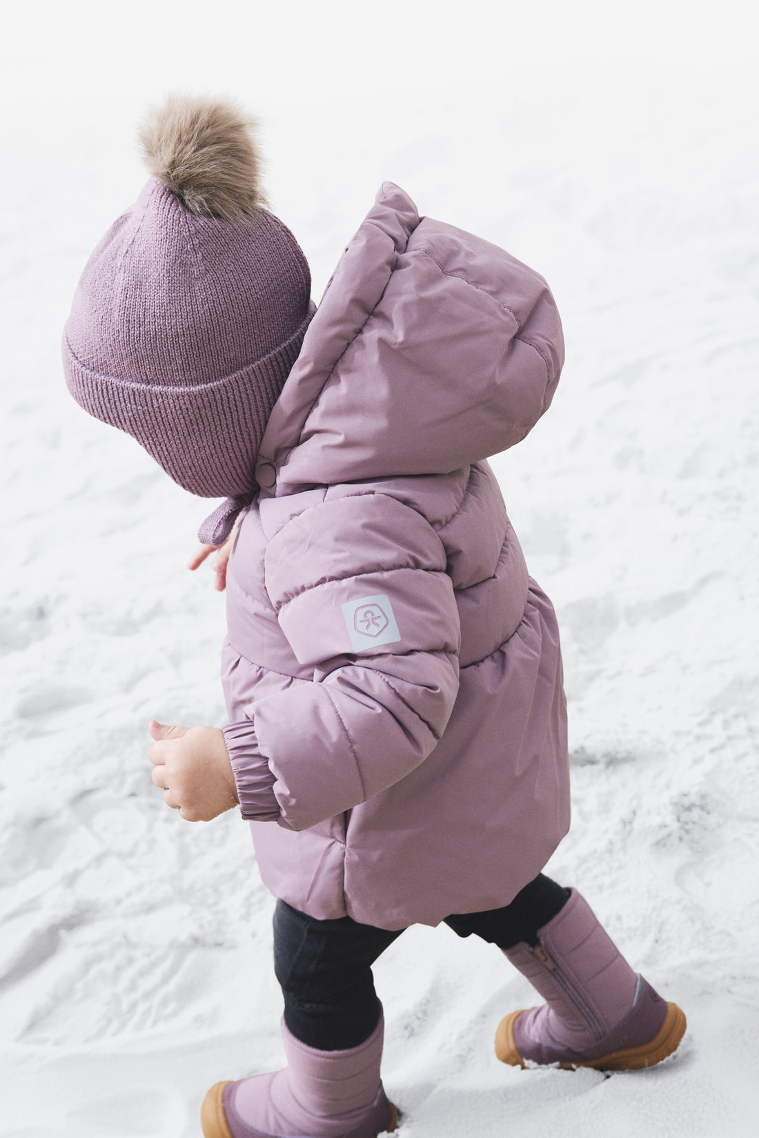 Color Kids Baby Quilted Jacket Toadstool side view worn by a child in the snow