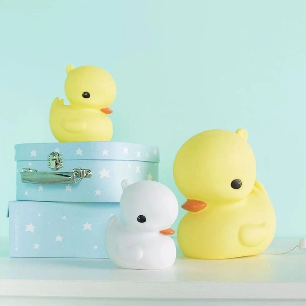 A Little Lovely Company Little Duck Lamp set; yellow and white rubber duck night lights on pastel blue starry boxes