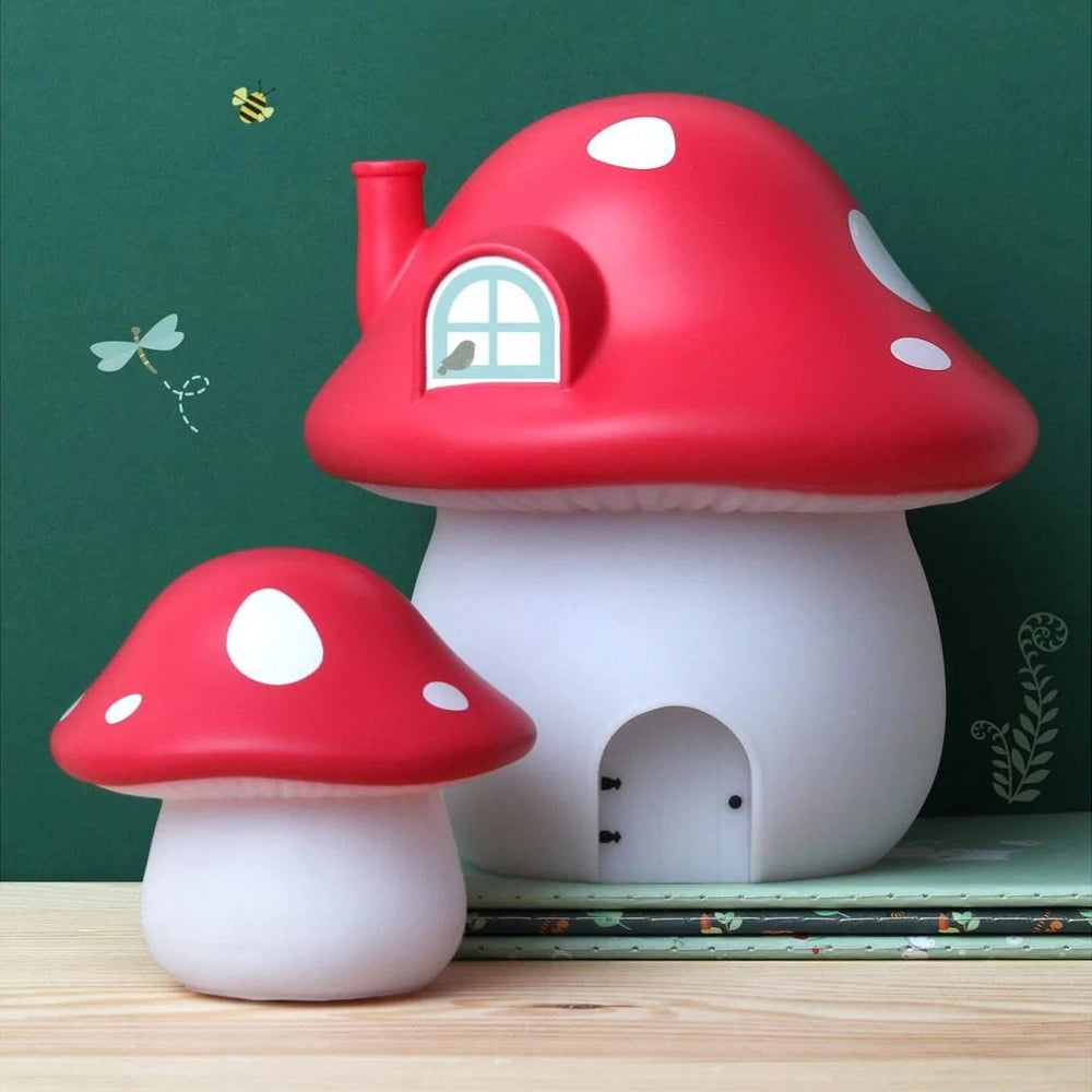 A Little Lovely Company red mushroom night light set with a large house-shaped lamp and a smaller one