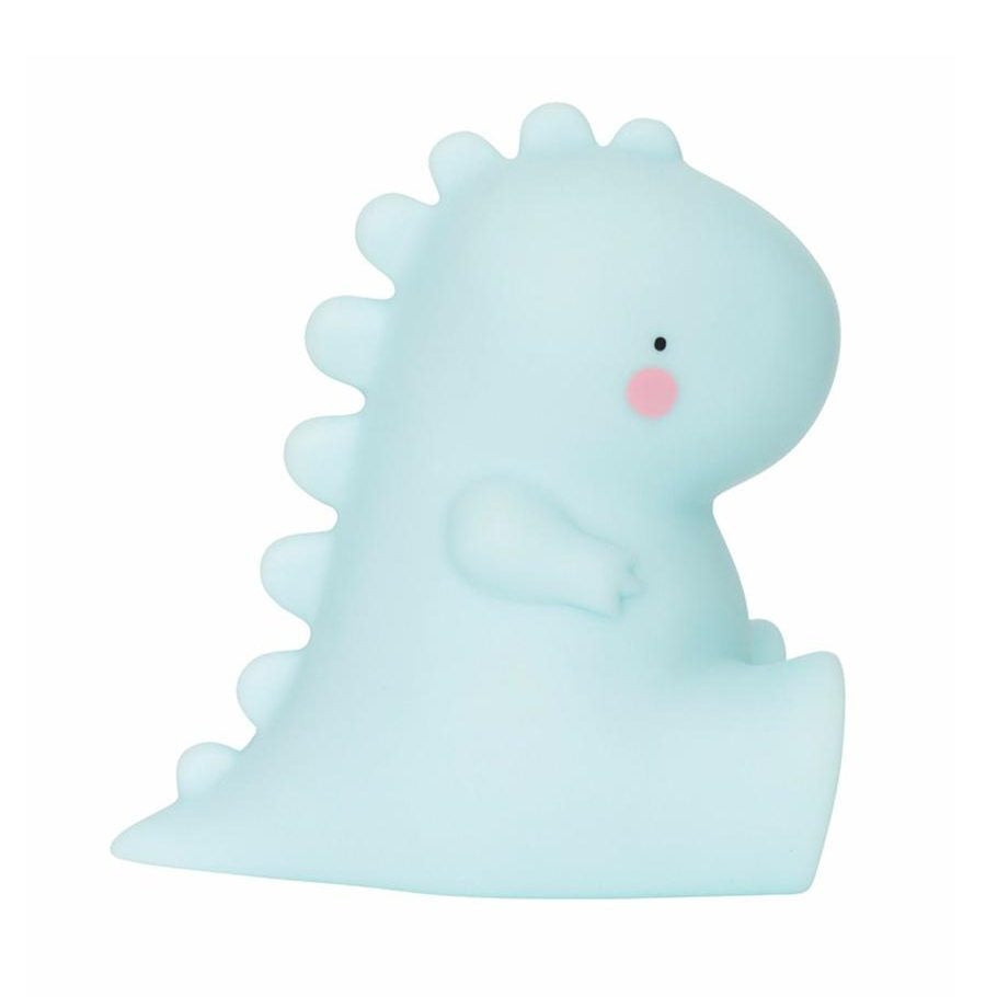 A Little Lovely Company Little Night Light T-Rex in pale blue, standing upright on a flat surface.