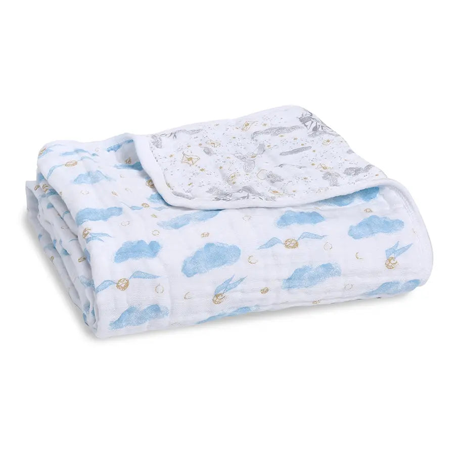 Aden+Anais Classic Dream Blanket, white with blue clouds, neatly folded for cozy newborn swaddling.