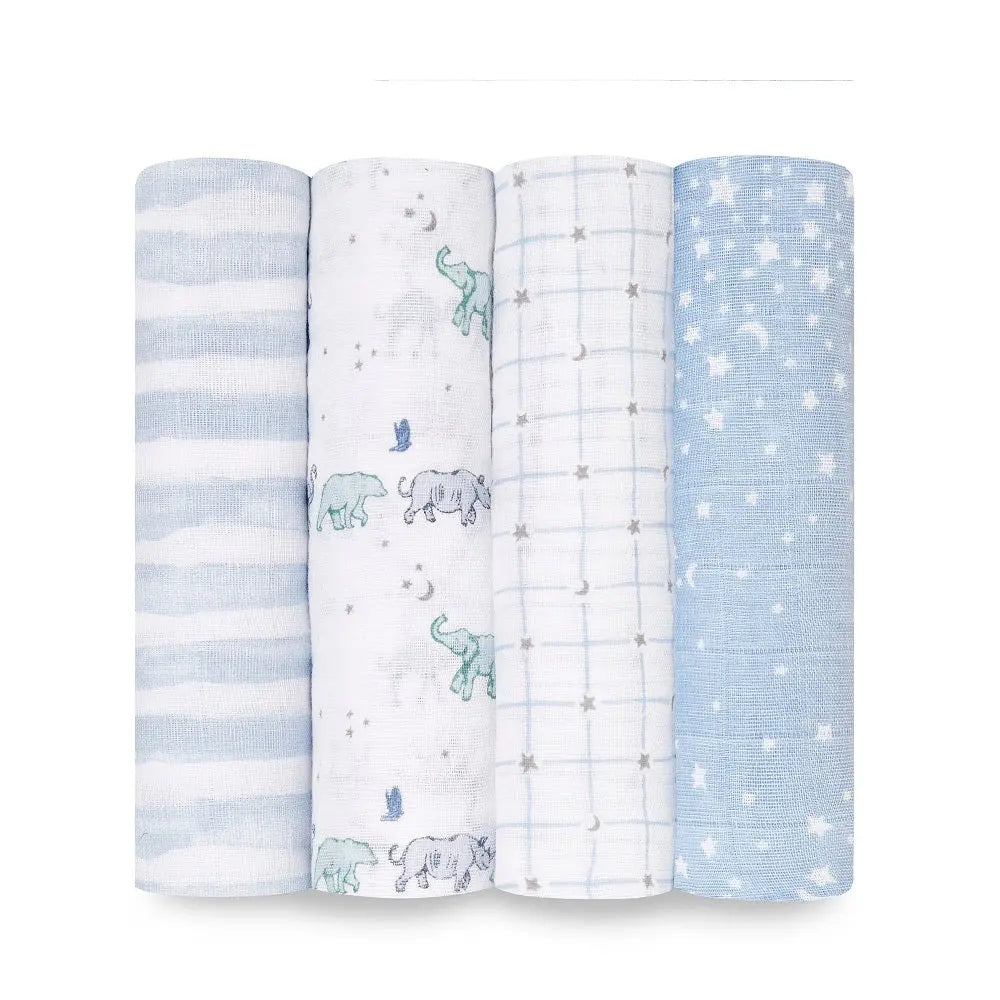 Aden+Anais Classic Swaddles 4Pk, four blue prints (clouds, elephants, grid, stars) neatly rolled for display