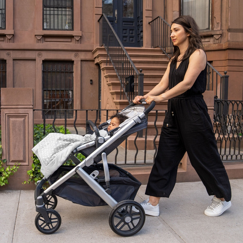 Aden+Anais Embrace Cross-Hatch Weighted On-The-Go Blanket in light gray on stroller