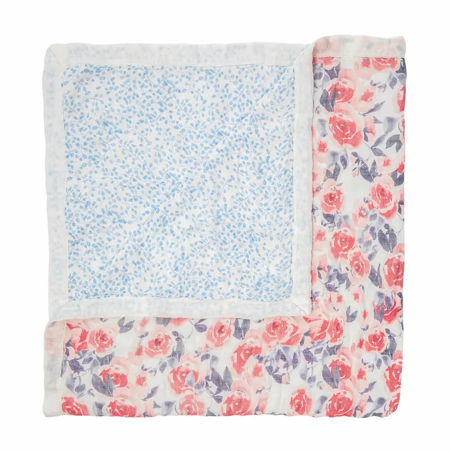 Aden+Anais Silky Soft Dream Blanket folded to reveal blue floral inner panel with pink rose border.
