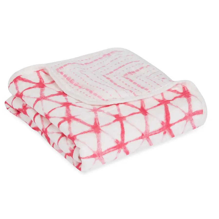 Aden+Anais Silky Stroller Blanket folded flat, pink lattice pattern on white, plush fabric