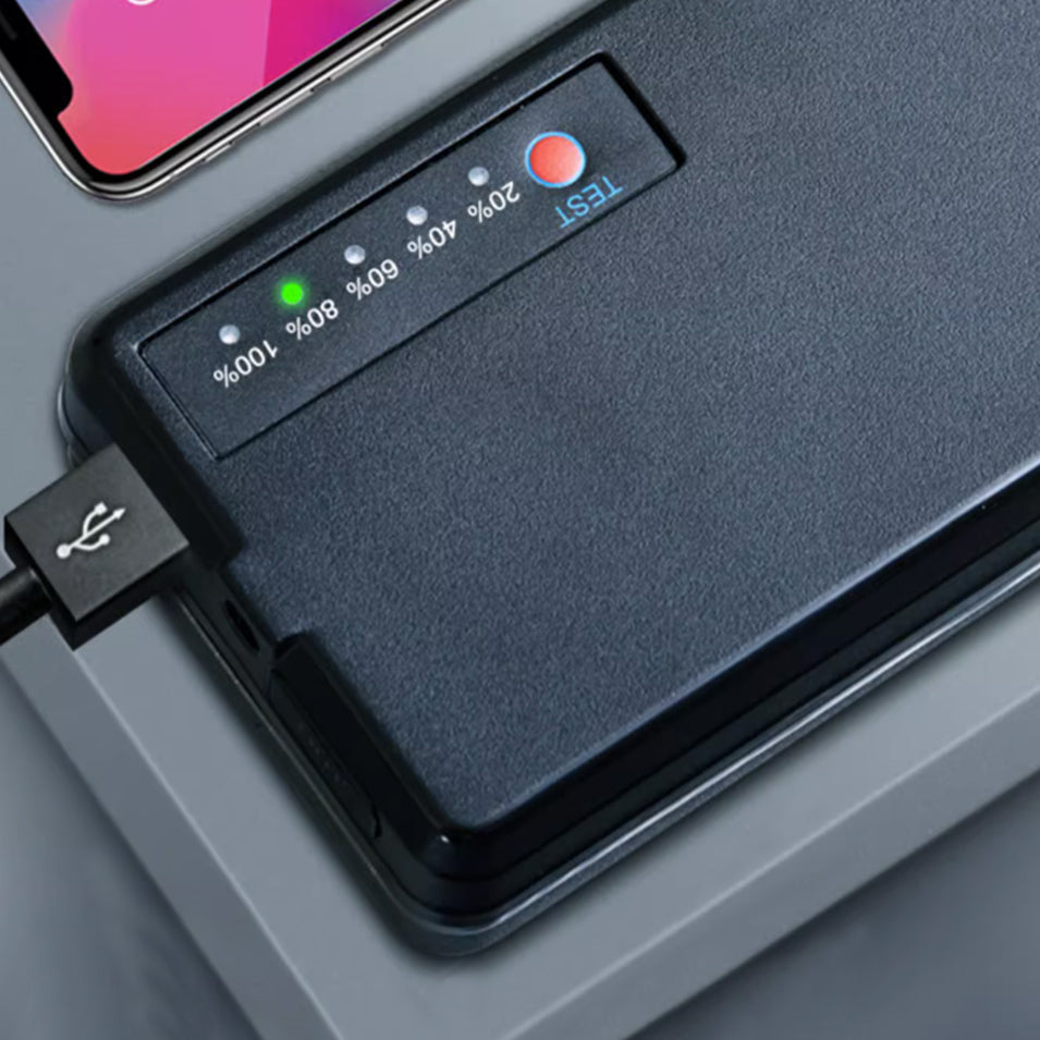 Airwheel lithium battery power bank with USB cable attached, four LED indicators and a green power light