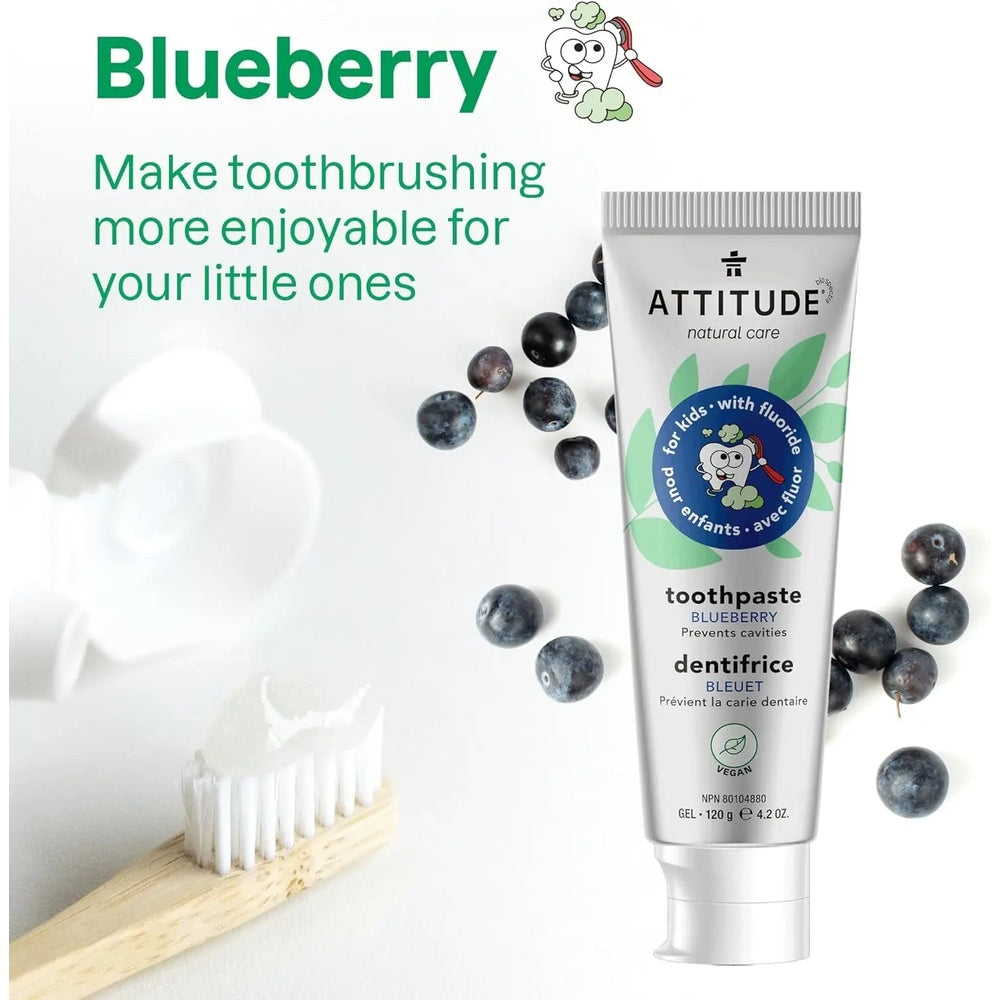 Attitude Kids Toothpaste With Fluoride 120G in blueberry flavor beside a toothbrush and blueberries, promoting fun brushing.