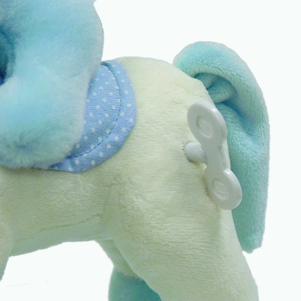 Aurora Ebba Musicals stuffed rocking horse plush in cream with blue mane and light-blue polka-dotted saddle.