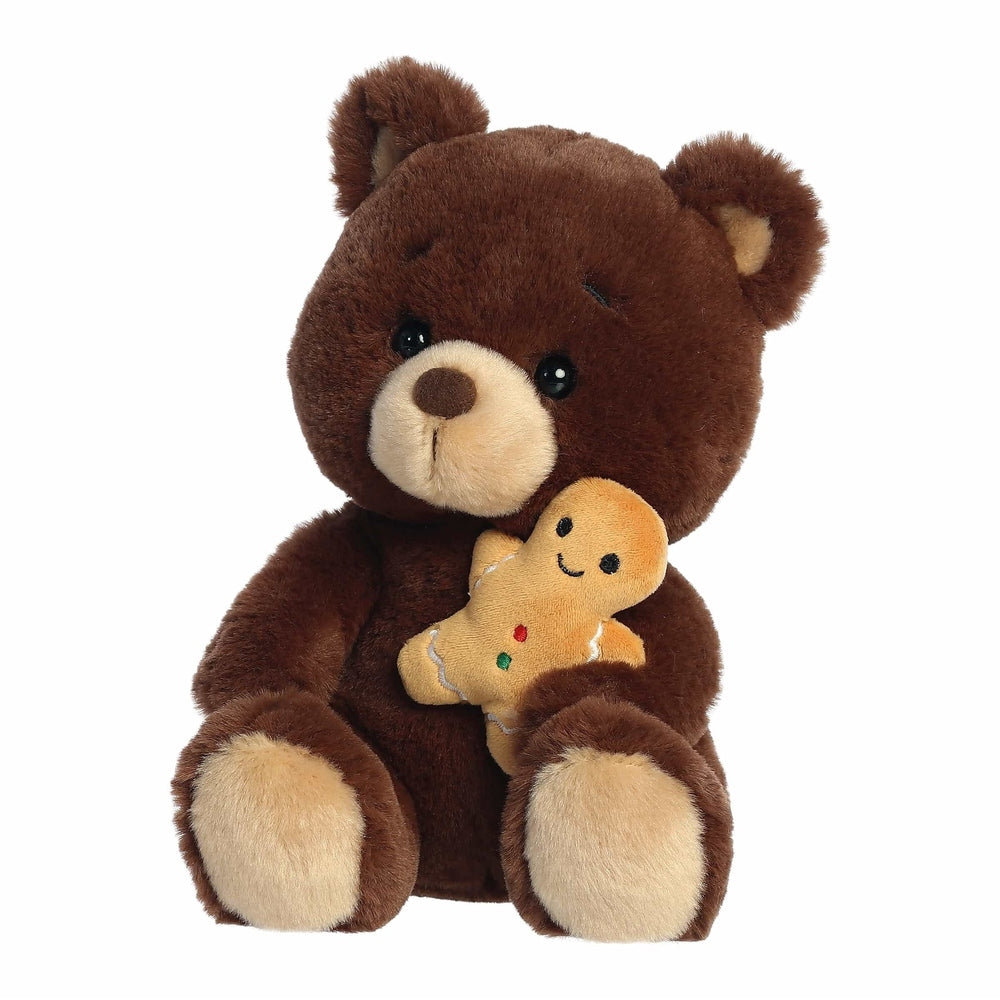 Aurora Holiday Barista Bear Gingerbread Man 10" plush teddy bear holds a smiling gingerbread man plush.