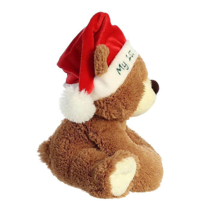 Aurora My First Christmas Bear plush; 10-inch brown stuffed bear wearing a red Santa hat with white pom and embroidered text.
