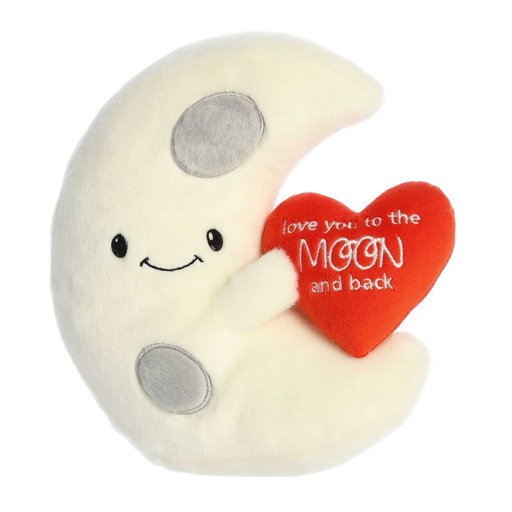 Cream plush moon with gray crater patches, smiling face, holding red heart with white 'love you to the MOON and back' text.