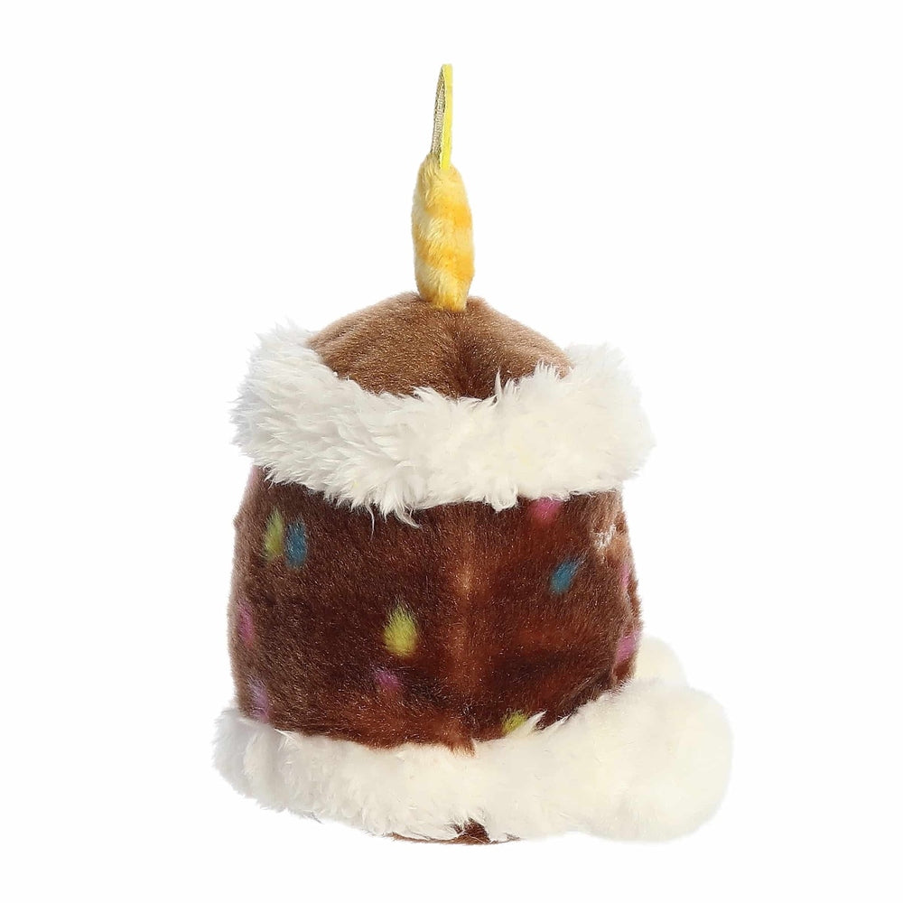 Aurora Palm Pals Choco Birthday Cake plush toy, brown cake with white fur trim and colorful sprinkles