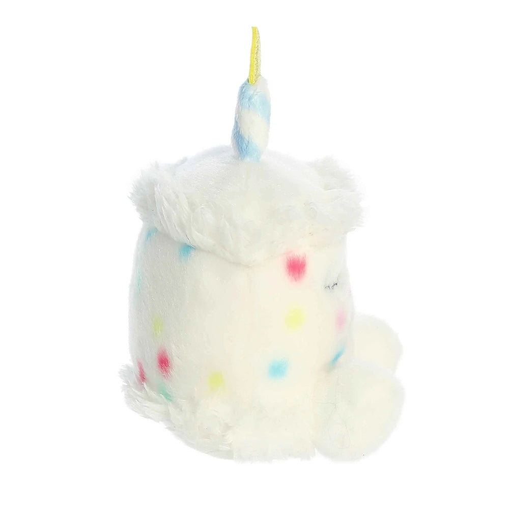 Aurora Palm Pals Happy B'Day Cake unicorn plush, white fur with pastel sprinkles and a yellow candle on top
