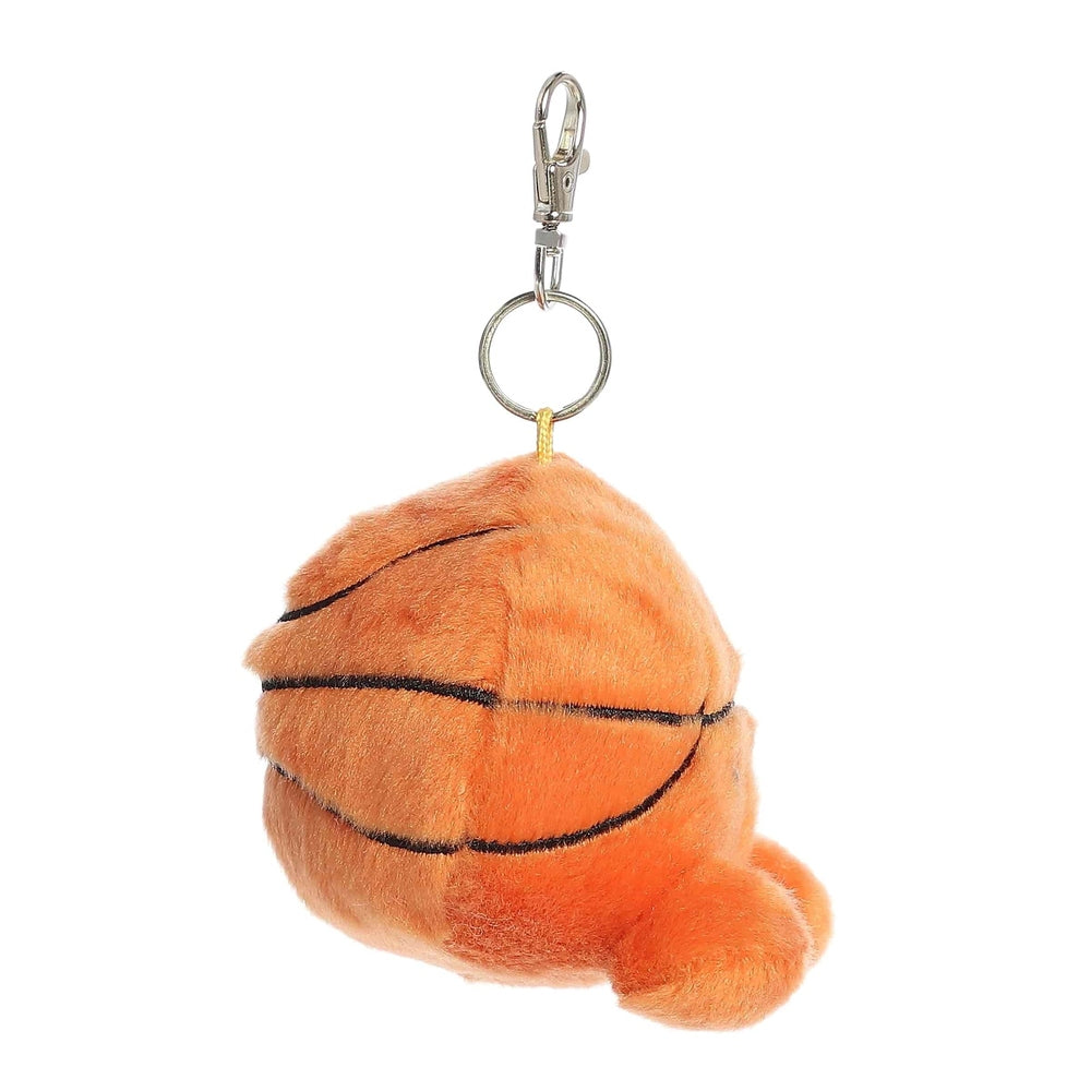 Aurora Palm Pals Hoops Basketball ClipOn 4" plush keychain in orange with black seams, hanging from a metal clip.