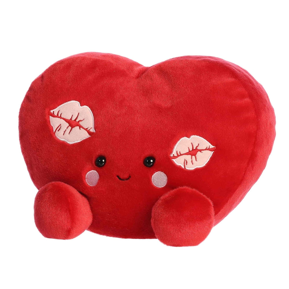 Aurora Palm Pals Kimi Kisses Heart plush, red heart-shaped stuffed toy with cute face and kiss patches.