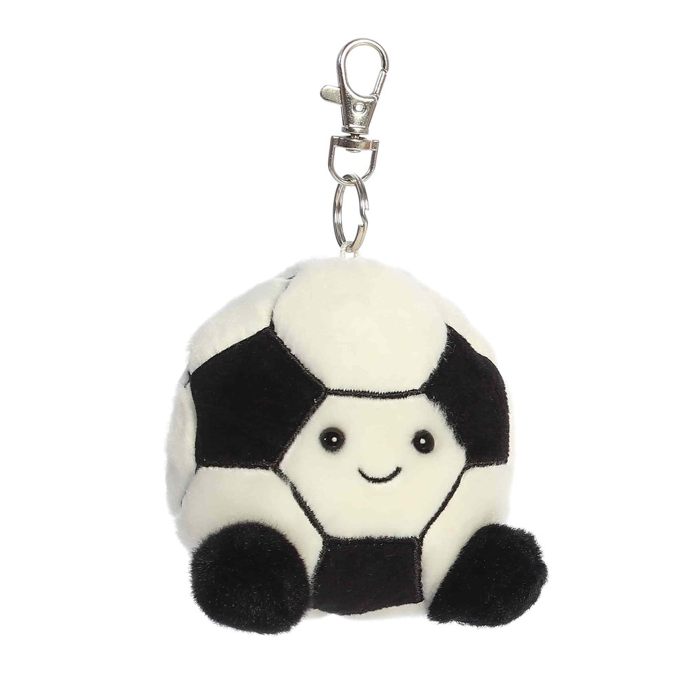 Aurora Palm Pals Striker Soccerball ClipOn plush toy, a white-black soccer ball with a smiling face, attached to a metal clip.