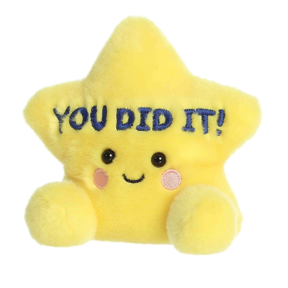 Aurora Palm Pals 5" yellow star plush, fuzzy fabric with blue "YOU DID IT!" embroidery and cute face