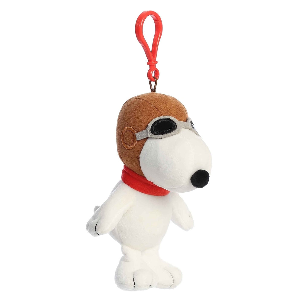Aurora Peanuts Flying Ace Clip-On 5-inch plush Snoopy in brown goggles and red scarf with red clip.