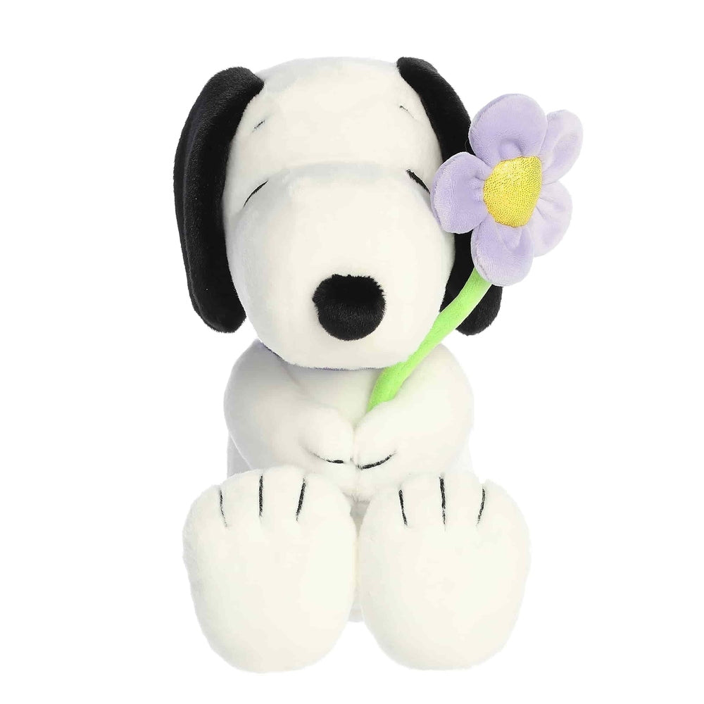 Aurora Snoopy 11 inch plush toy holding a purple daisy, white with black ears