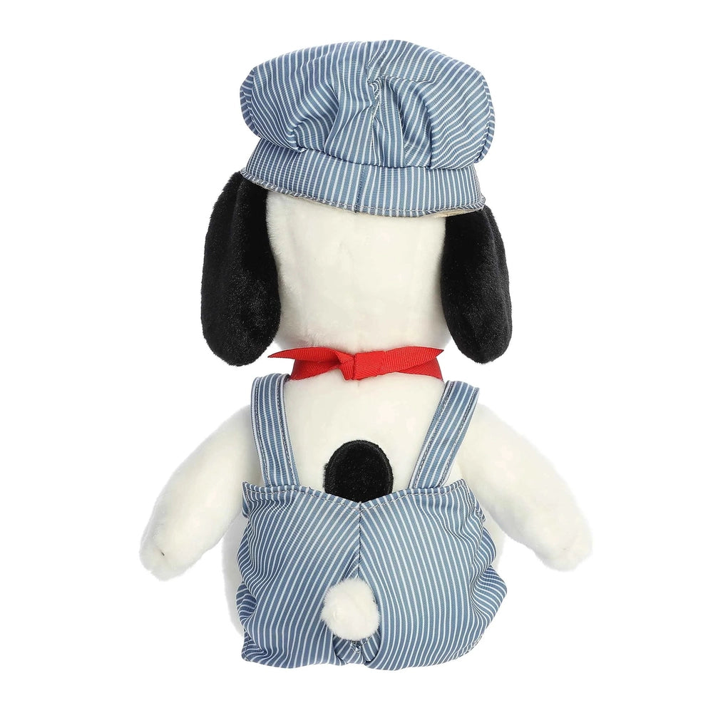 Aurora Peanuts Train Engineer Snoopy plush wearing blue striped overalls, cap, and red scarf.