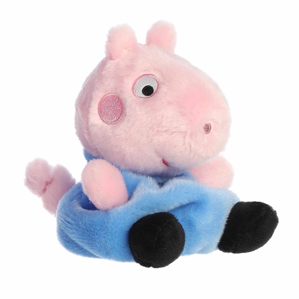 George Pig Palm Pal plush toy by Aurora, 5-inch pink stuffed animal wearing blue pants and black feet