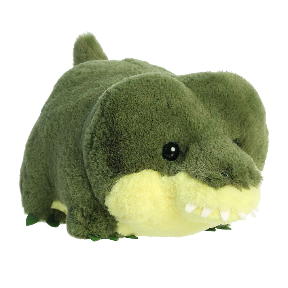 Aurora Spudsters August Alligator 10" plush toy, green with pale yellow belly, lying down with soft fur and tiny teeth.