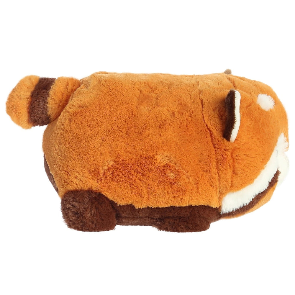 Aurora Spudsters Remy Red Panda 10-inch plush toy, soft orange fur with white face, lying on its side